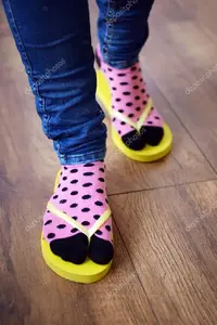 depositphotos_68856815-stock-photo-female-feet-in-socks-with.webp
