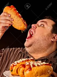 82424213-el-fracaso-de-la-dieta-del-hombre-gordo-comiendo-el-perro-caliente-de-la-comida-rápid...jpg