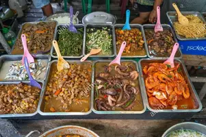 a-selection-of-various-street-foods-for-sale-at-a-traditional-food-outlet-known-as-a-carinderi...jpg