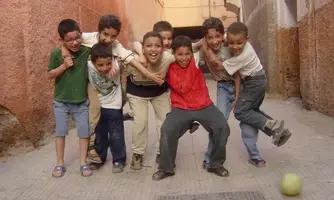 children-playing-soccer-marrakech-morocco.webp